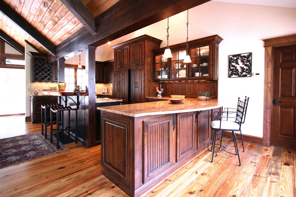 Photo of a country eat-in kitchen in Charlotte with an undermount sink and medium wood cabinets.