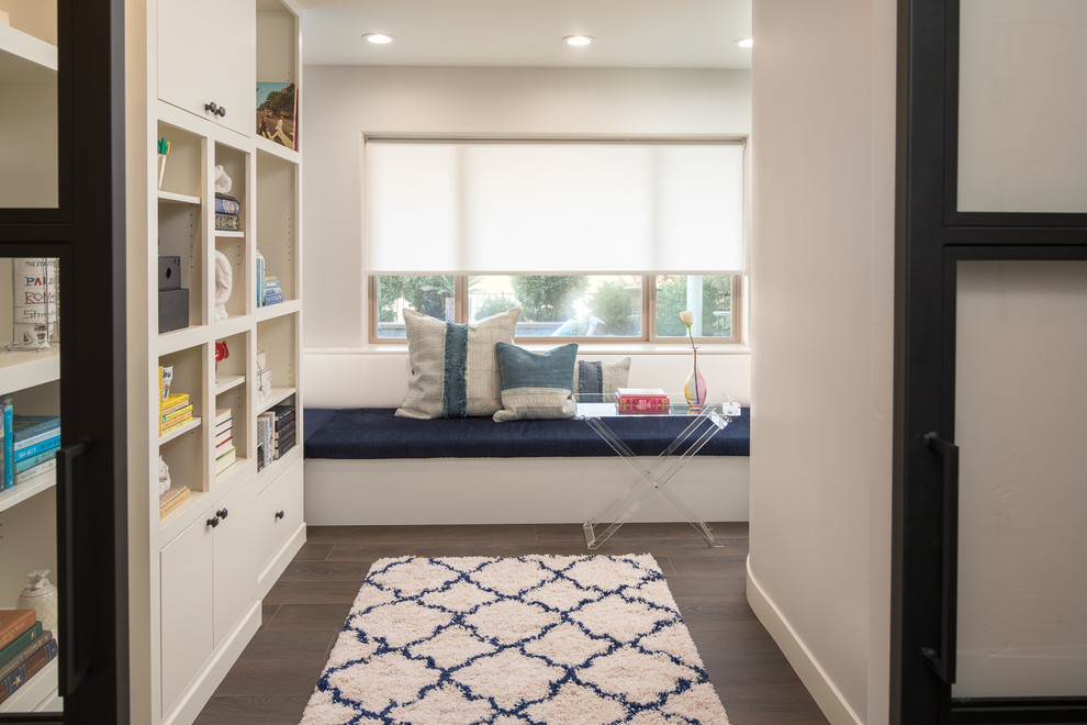 This is an example of a mid-sized eclectic gender-neutral kids' room in Sacramento with porcelain floors, brown floor and beige walls.