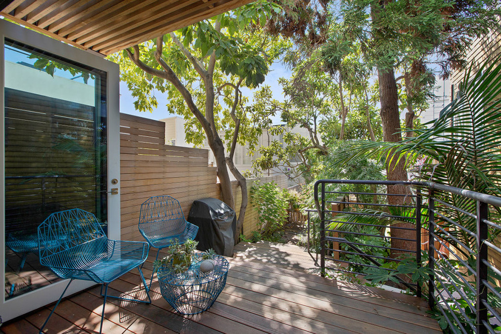 Design ideas for a small contemporary backyard deck in San Francisco with a pergola.