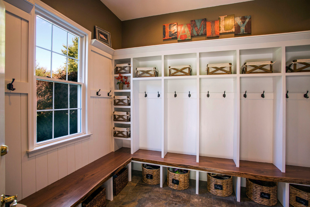 Inspiration for a country mudroom in Philadelphia with brown walls.
