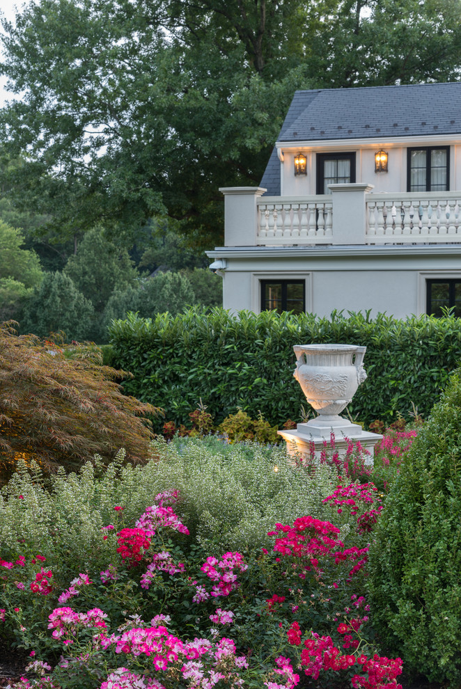 Inspiration for an expansive traditional backyard full sun formal garden for summer in DC Metro with a container garden.