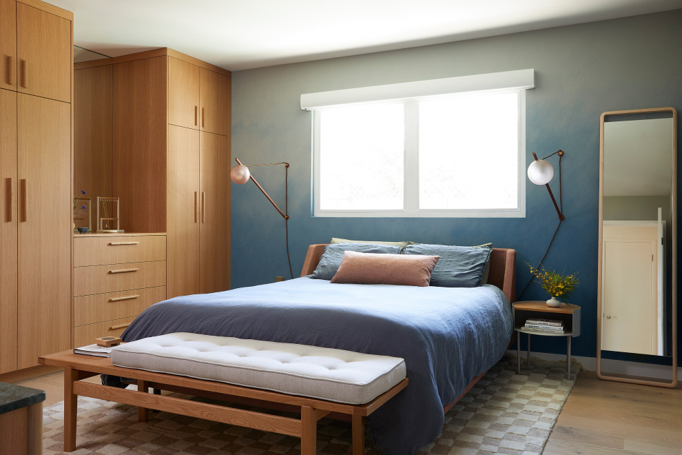 Bedroom - mid-sized contemporary master light wood floor, brown floor and wallpaper bedroom idea in San Francisco with blue walls and no fireplace