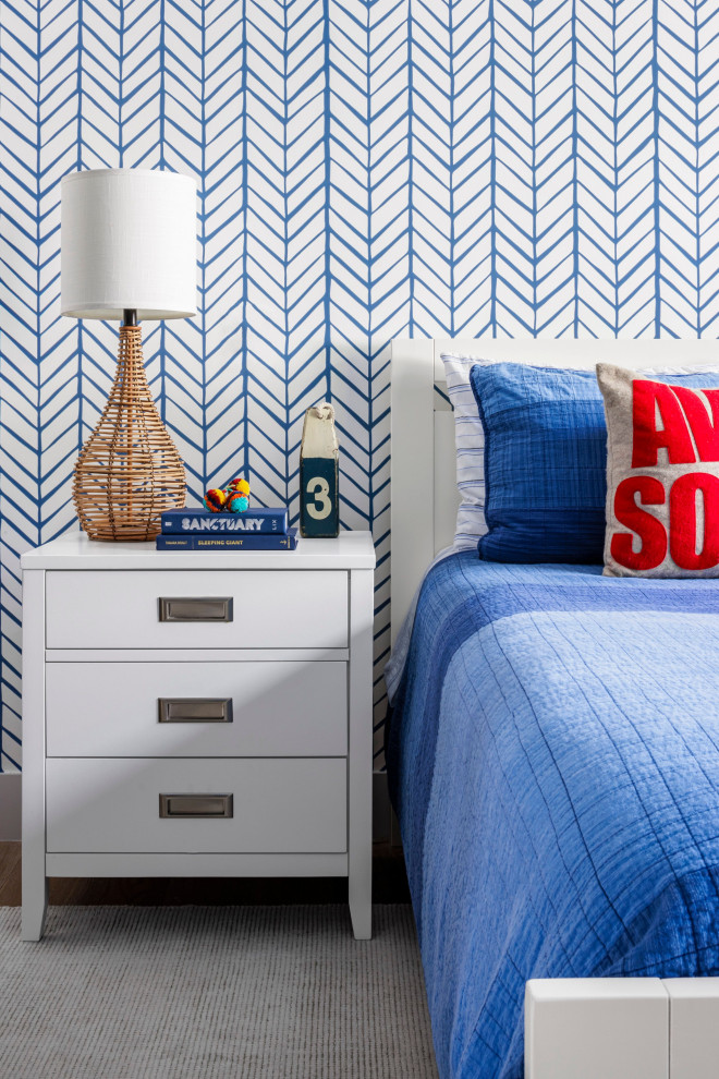 Photo of a mid-sized beach style kids' room for boys in Miami with wallpaper, multi-coloured walls, medium hardwood floors and brown floor.