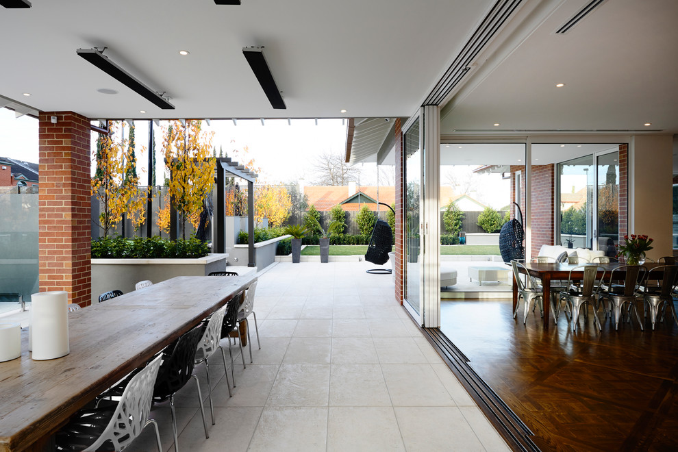 Contemporary patio in Melbourne with a pergola.