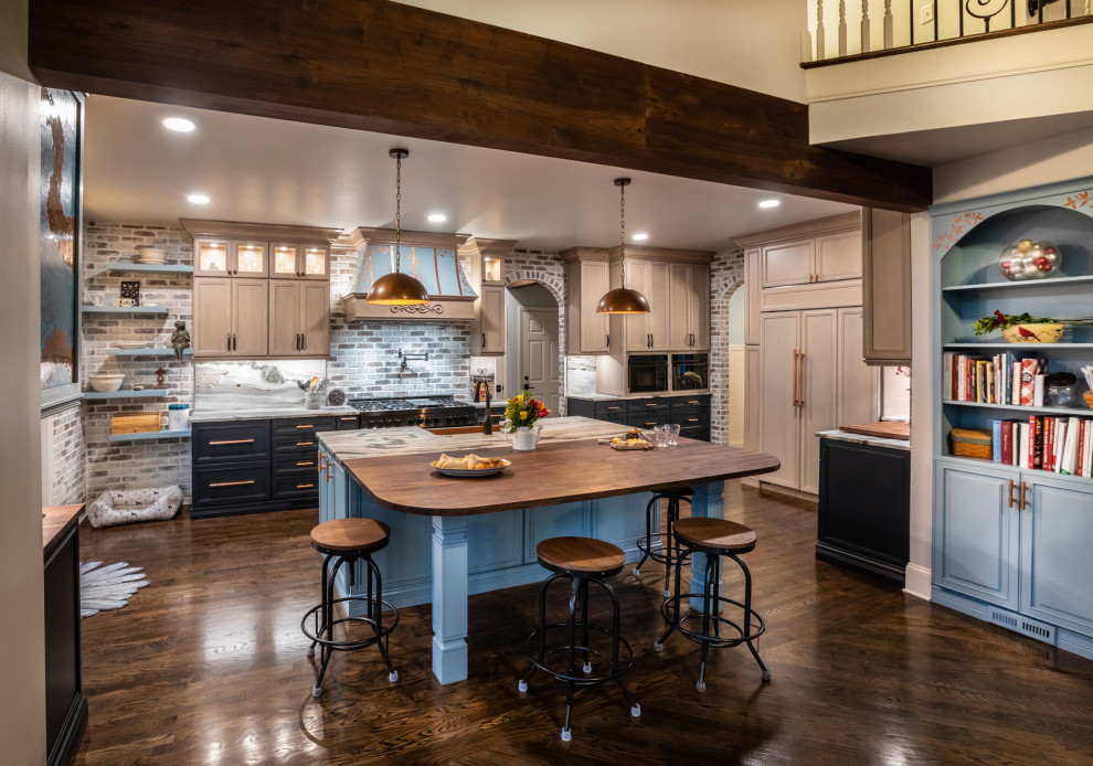 Mid-sized country l-shaped open plan kitchen in Atlanta with a farmhouse sink, raised-panel cabinets, dark hardwood floors, with island and exposed beam.