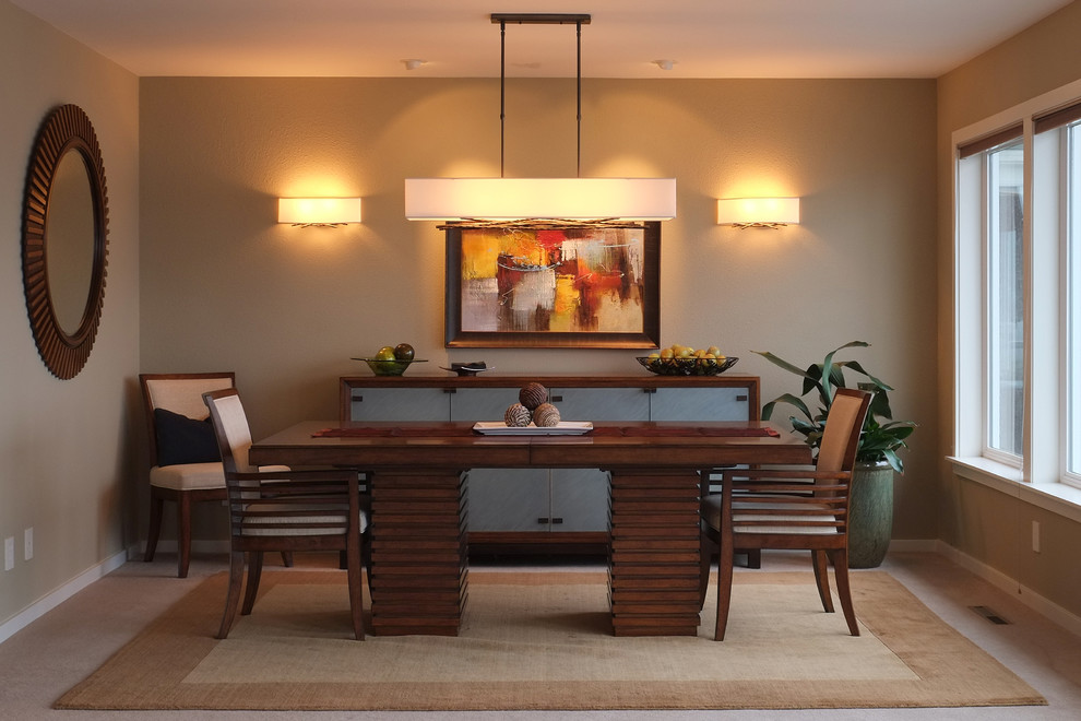 Photo of a mid-sized contemporary separate dining room in Seattle with beige walls, carpet and no fireplace.