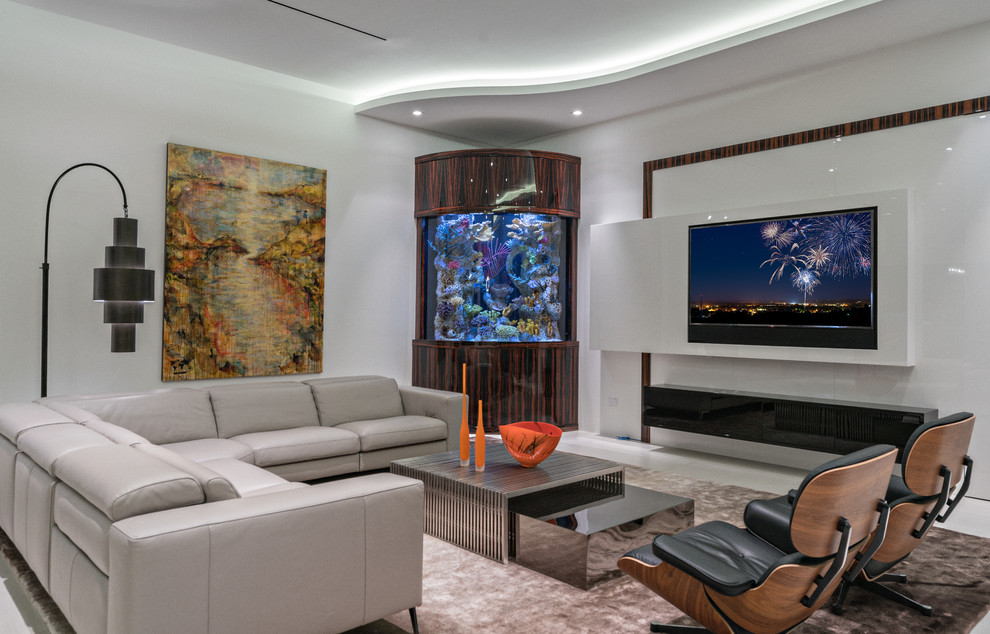 Contemporary family room in Miami with white walls, a ribbon fireplace and a wall-mounted tv.