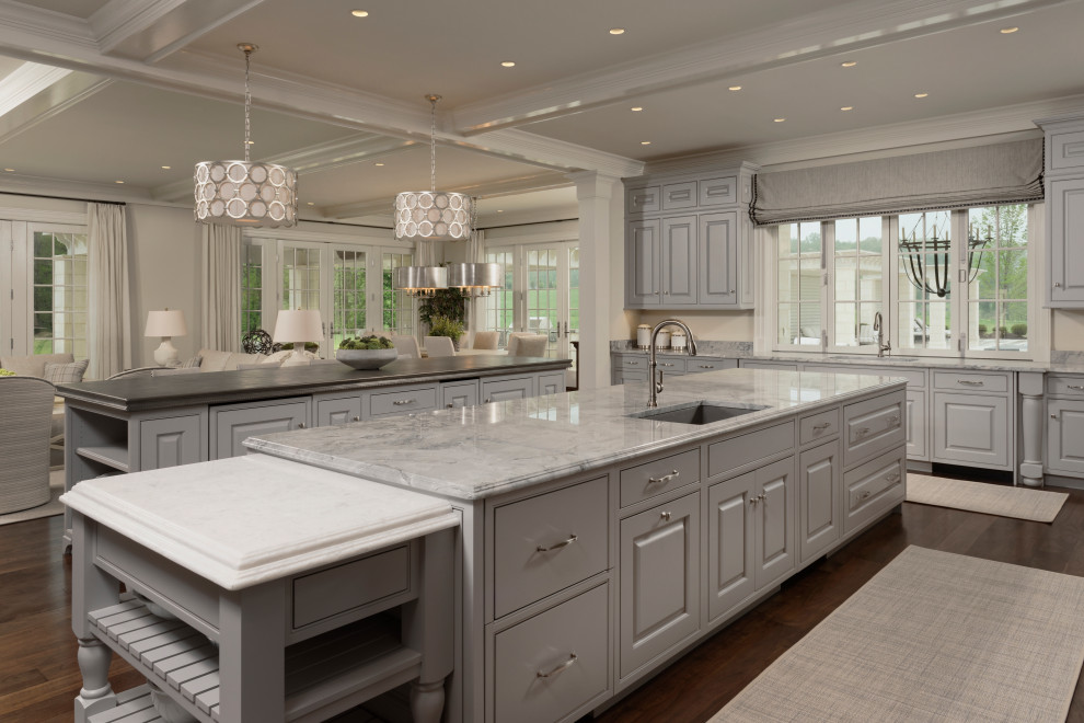 Large transitional dark wood floor open concept kitchen photo in DC Metro with an undermount sink, shaker cabinets, gray cabinets, marble countertops, multicolored backsplash, ceramic backsplash, stainless steel appliances, two islands and gray countertops