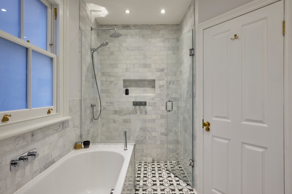 Inspiration for a large contemporary family bathroom in London with blue cabinets, a built-in bath, a walk-in shower, a two-piece toilet, grey tiles, an integrated sink, marble worktops, a hinged door, a single sink and a freestanding vanity unit.
