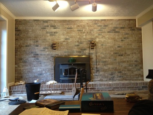 What to do with a brick fireplace wall? I just got finished whitewashing our brick wall in our basement. I