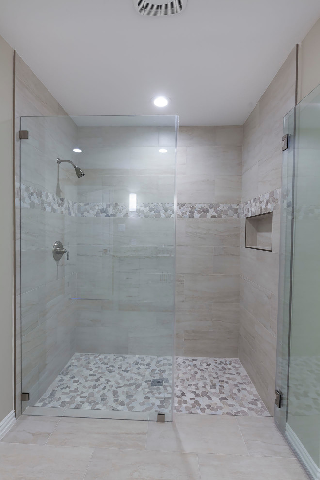 Design ideas for a large modern master bathroom in Houston with shaker cabinets, white cabinets, an alcove shower, a two-piece toilet, beige walls, cement tiles, granite benchtops, grey floor, a hinged shower door, beige benchtops, a double vanity and a built-in vanity.