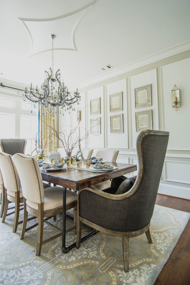 Inspiration for a transitional dining room in Atlanta with beige walls, medium hardwood floors and brown floor.