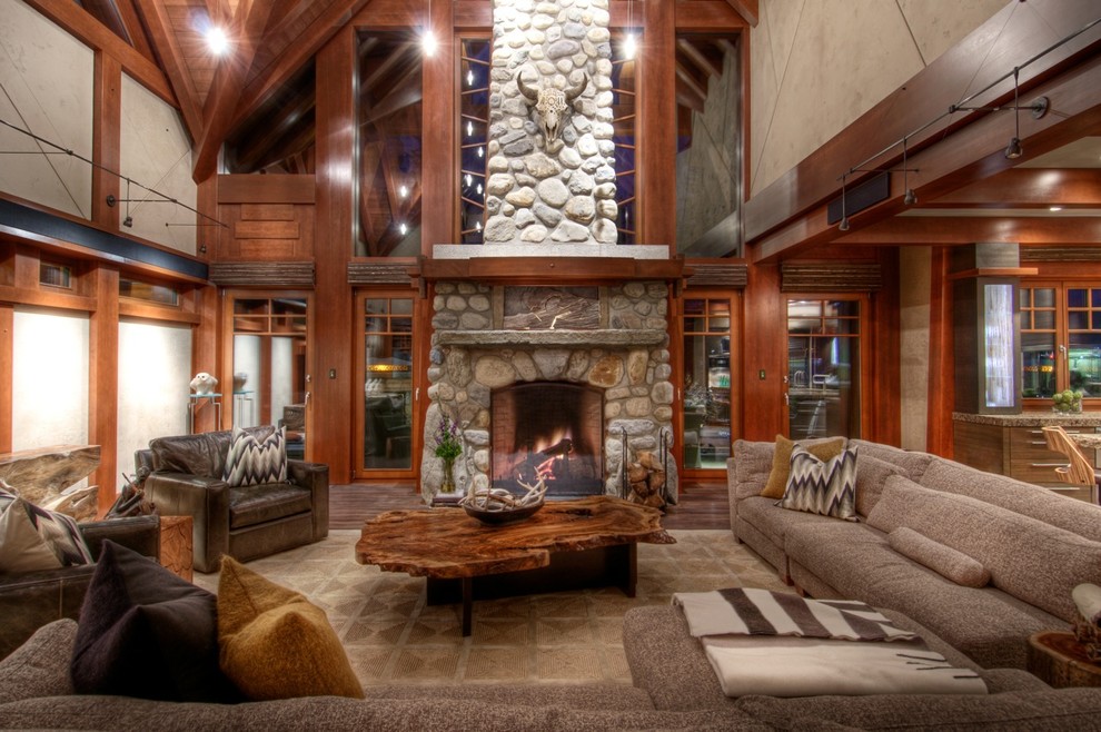 Design ideas for a country living room in Vancouver with a stone fireplace surround.