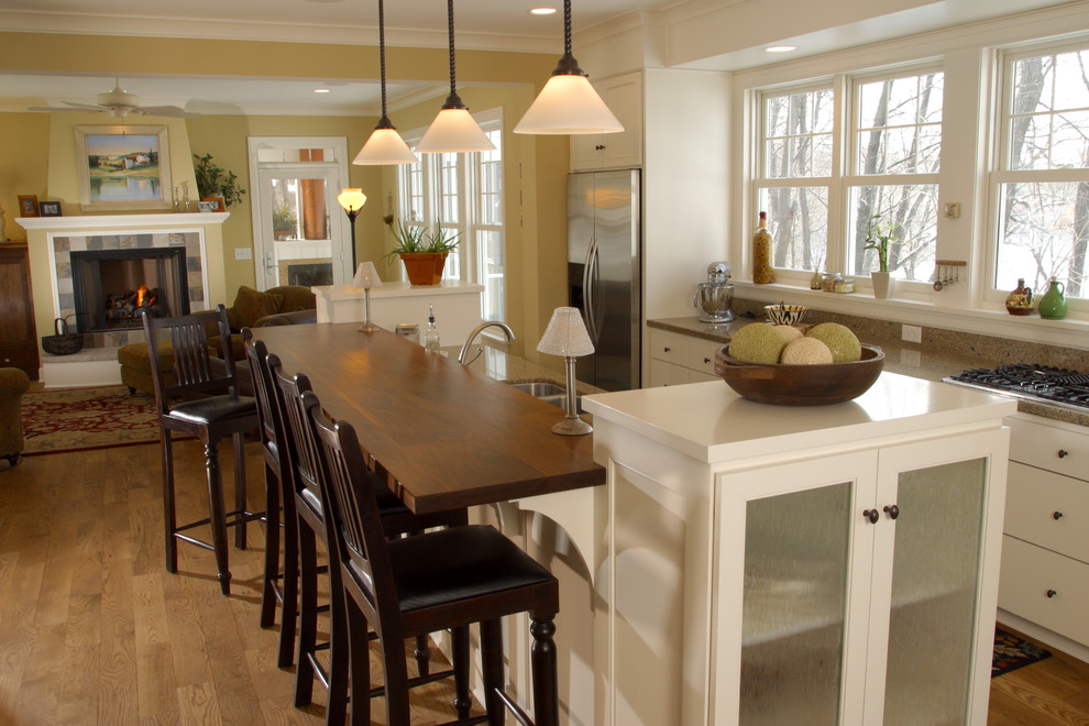 Country kitchen in Minneapolis with stainless steel appliances and wood benchtops.