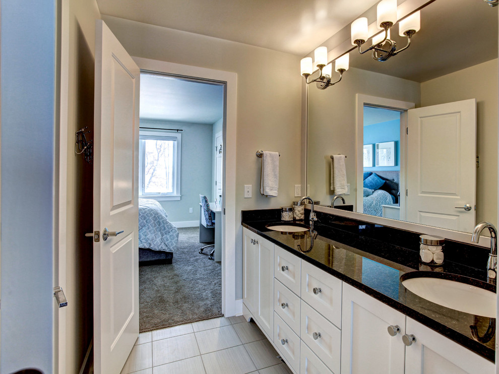Large arts and crafts master bathroom in Grand Rapids with white cabinets, granite benchtops, grey walls, ceramic floors and shaker cabinets.