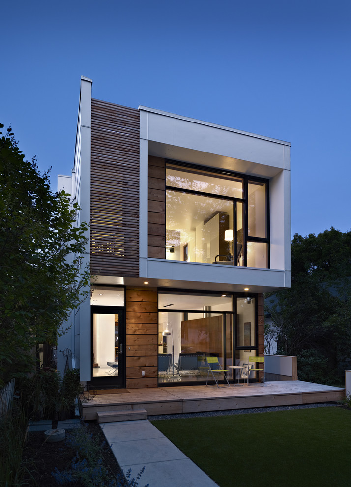 Inspiration for a modern exterior in Edmonton with wood siding.
