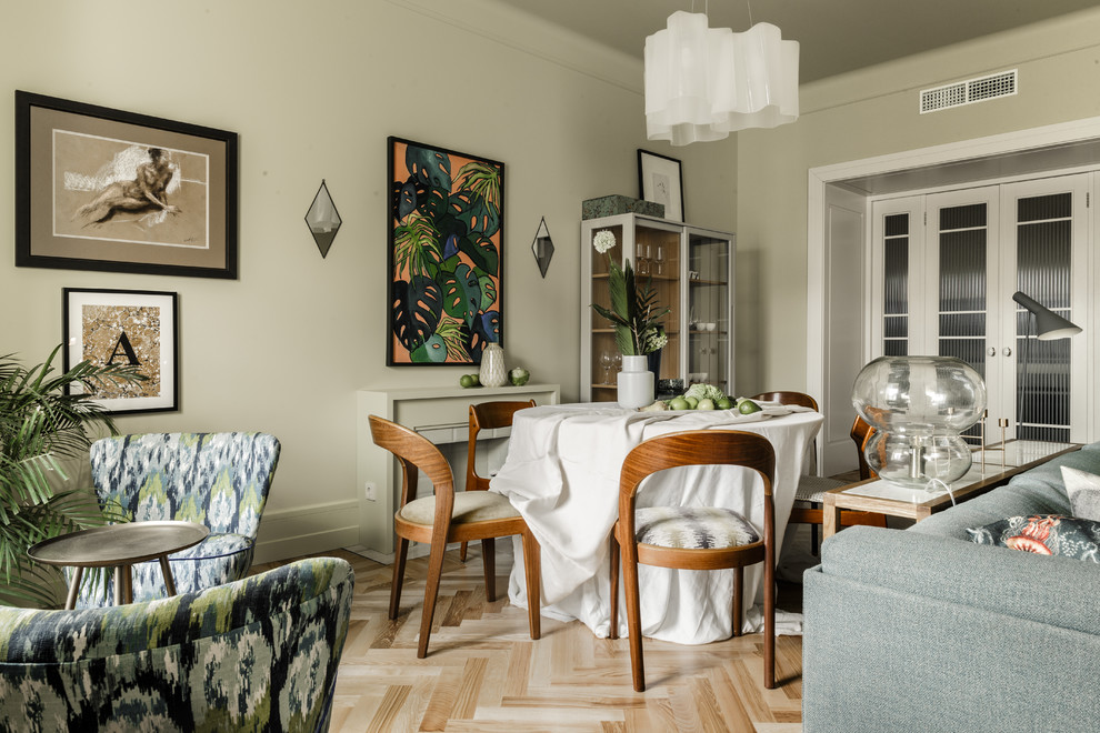This is an example of a transitional open plan dining in Other with beige walls, light hardwood floors and beige floor.