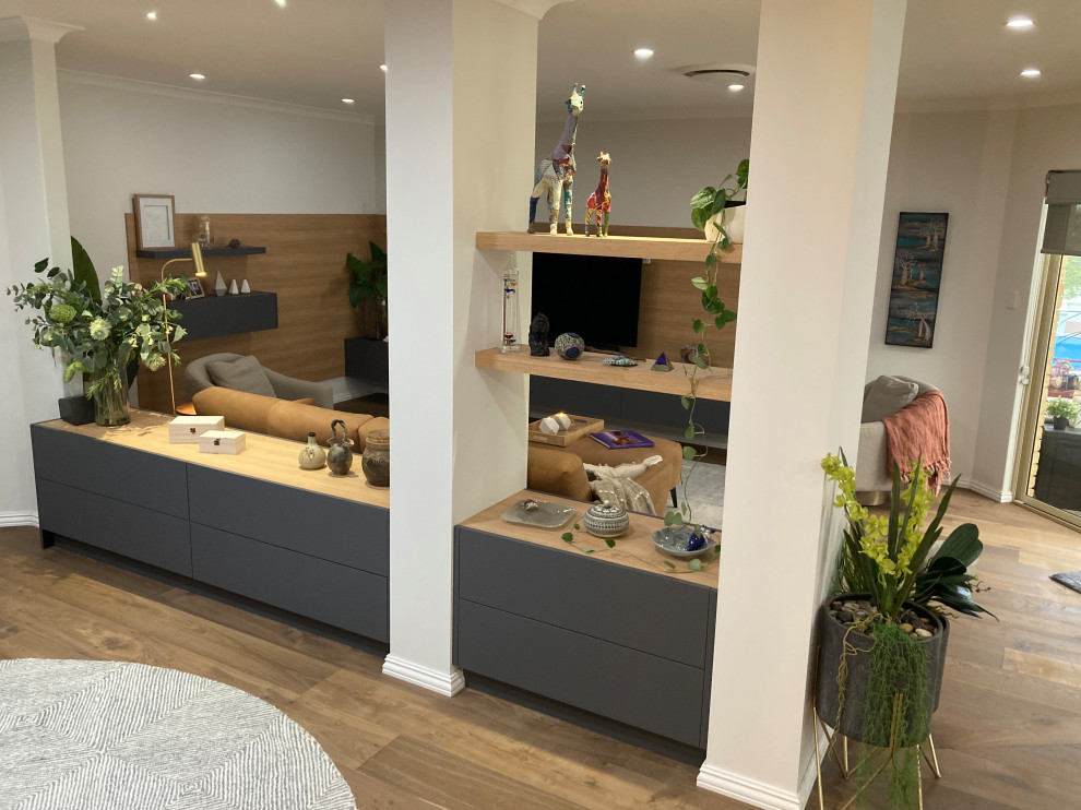 Photo of a large beach style formal open concept living room in Perth with multi-coloured walls, dark hardwood floors, a built-in media wall, brown floor and decorative wall panelling.