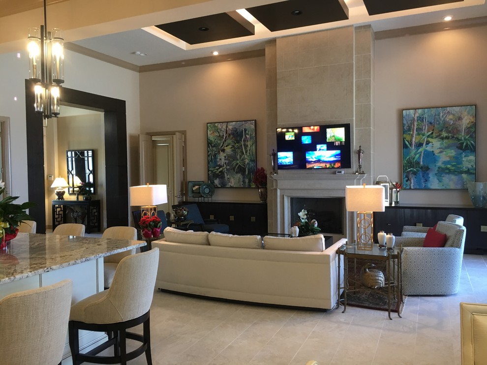 Inspiration for an expansive transitional open concept living room in Tampa with beige walls, travertine floors, a standard fireplace, a stone fireplace surround and beige floor.