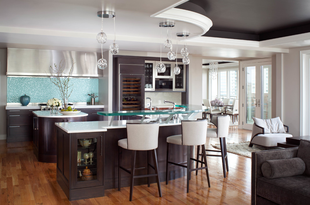 Photo of a contemporary open plan kitchen in Denver with flat-panel cabinets, dark wood cabinets, blue splashback, medium hardwood floors and with island.