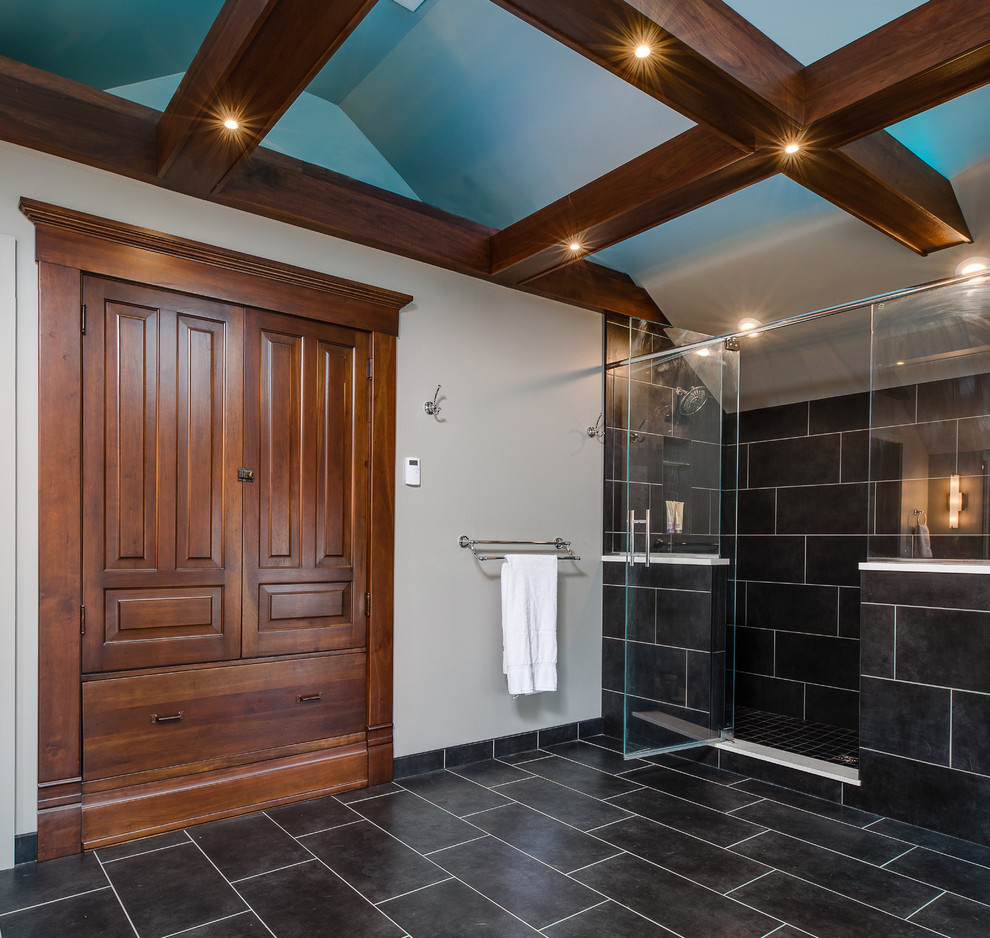 Photo of an expansive transitional master bathroom in Other with an undermount sink, flat-panel cabinets, dark wood cabinets, engineered quartz benchtops, a freestanding tub, a double shower, a one-piece toilet, multi-coloured tile, ceramic tile, grey walls and ceramic floors.