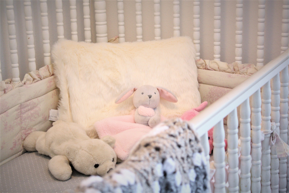 Example of a mid-sized girl carpeted and blue floor nursery design with white walls