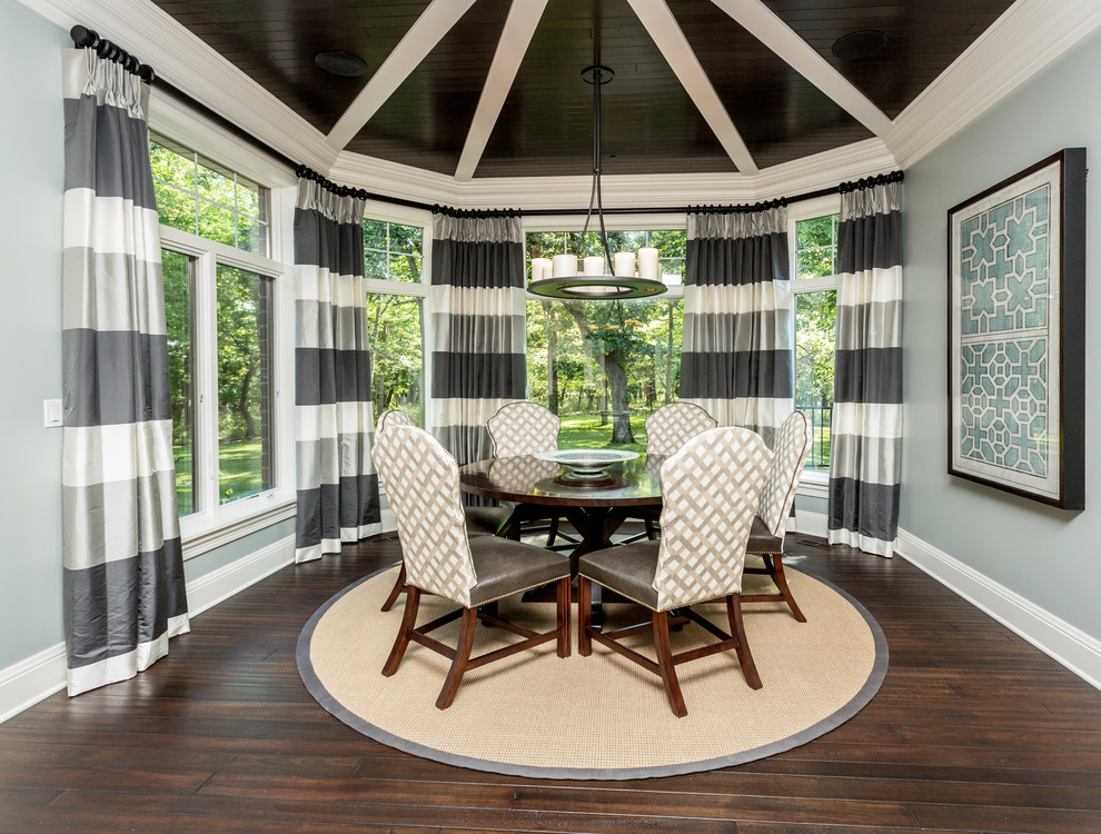 Inspiration for a transitional dining room in Other with grey walls and dark hardwood floors.