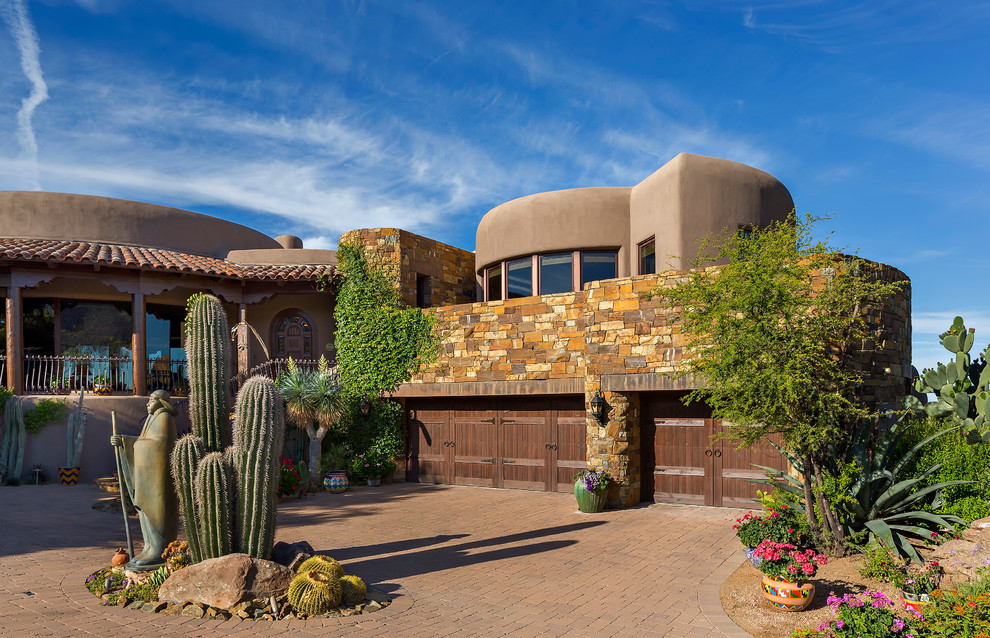 Design ideas for a two-storey beige exterior in Phoenix.