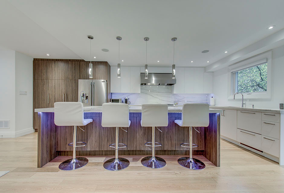 Kitchen - large contemporary light wood floor kitchen idea in Toronto with an undermount sink, flat-panel cabinets, medium tone wood cabinets, stainless steel appliances and an island