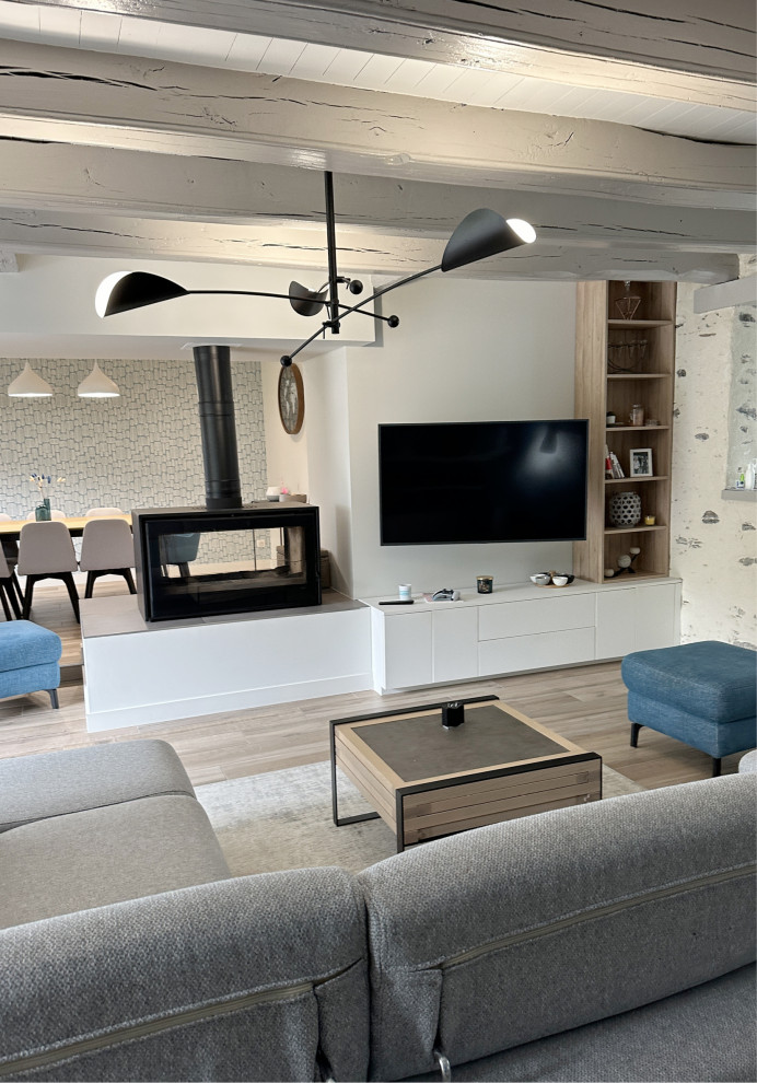 Inspiration for a contemporary living room in Nantes with beige walls, ceramic flooring, a two-sided fireplace and a wall mounted tv.