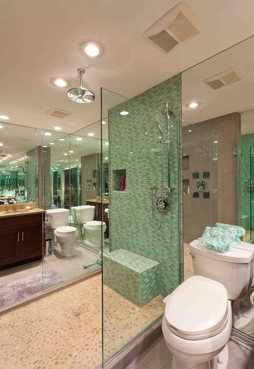 Design ideas for a mid-sized contemporary master bathroom in Richmond with shaker cabinets, dark wood cabinets, an alcove shower, a one-piece toilet, blue tile, glass tile, ceramic floors, a vessel sink and limestone benchtops.
