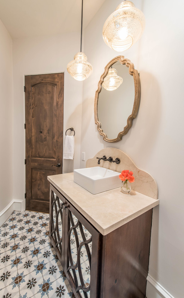 Large mediterranean bathroom in Houston with glass-front cabinets, dark wood cabinets, a one-piece toilet, beige walls, mosaic tile floors, a drop-in sink, marble benchtops and multi-coloured floor.