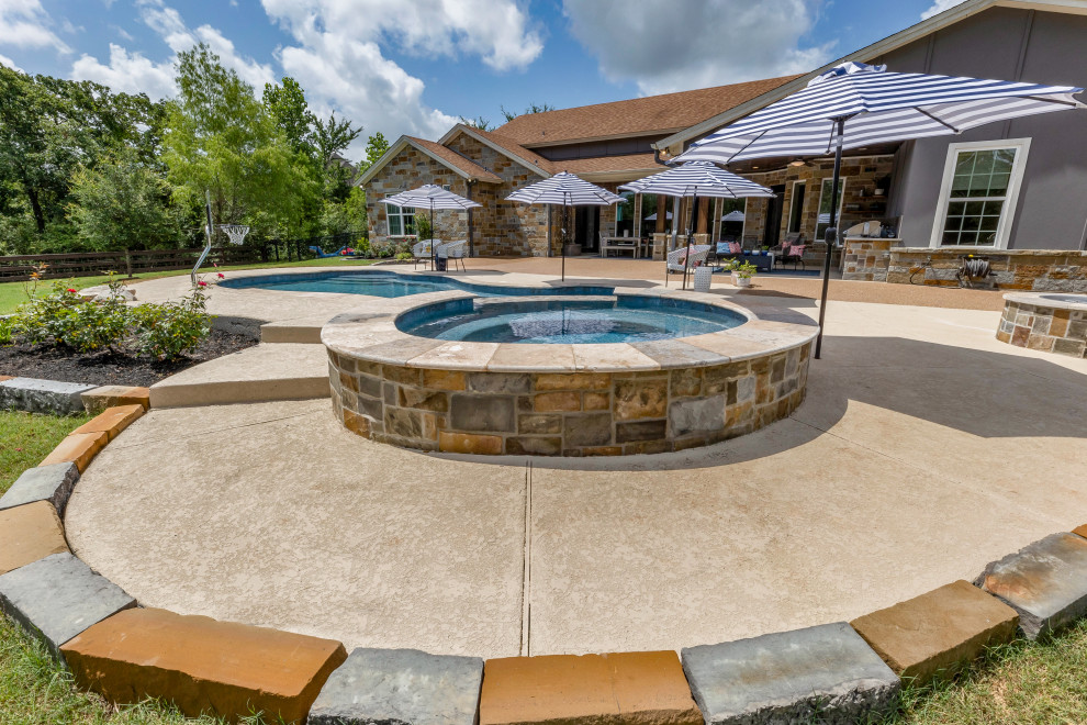 Pool - mid-sized backyard custom-shaped natural pool idea with decking