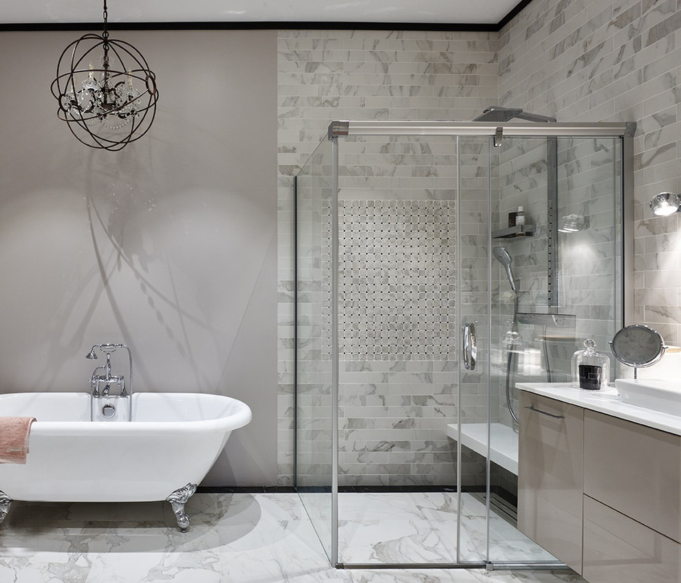 This is an example of a transitional bathroom in Moscow with flat-panel cabinets, beige cabinets, a claw-foot tub, a corner shower, gray tile, grey walls, white floor, a sliding shower screen and white benchtops.