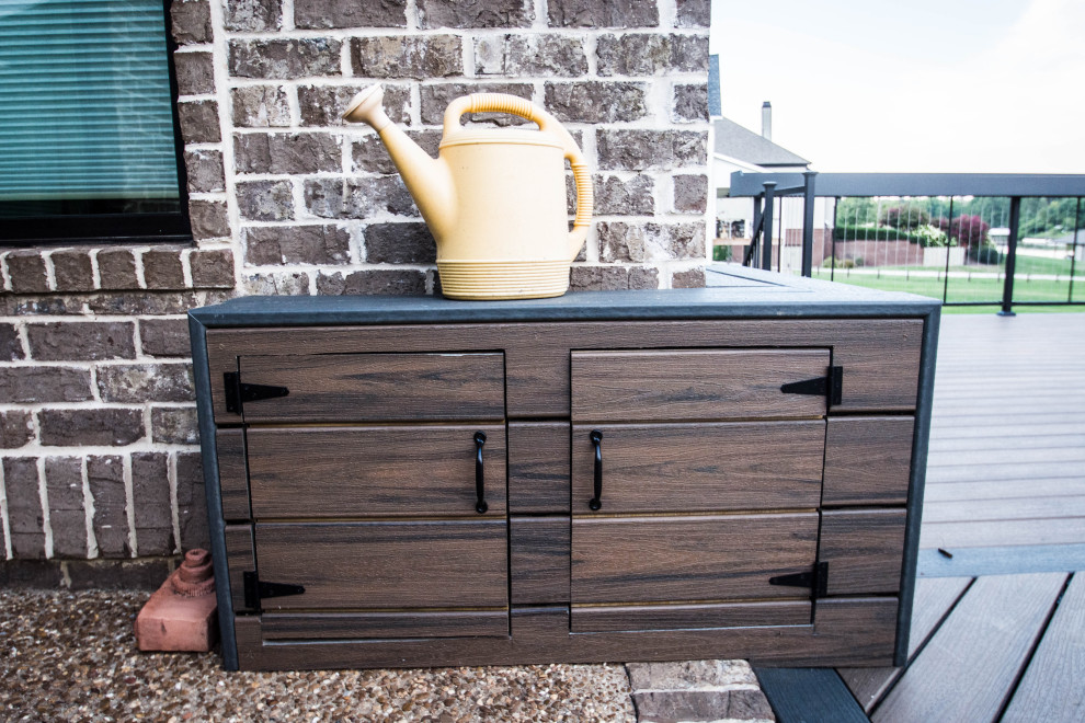 Example of a large transitional backyard deck design with a fire pit and no cover