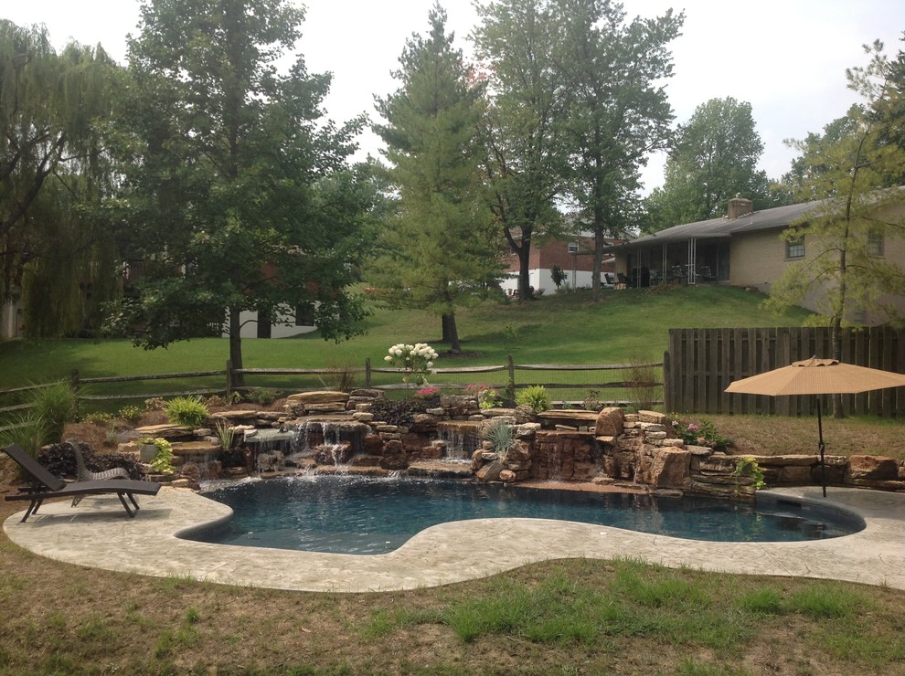 Inspiration for a small backyard stamped concrete and custom-shaped natural pool remodel in Cincinnati