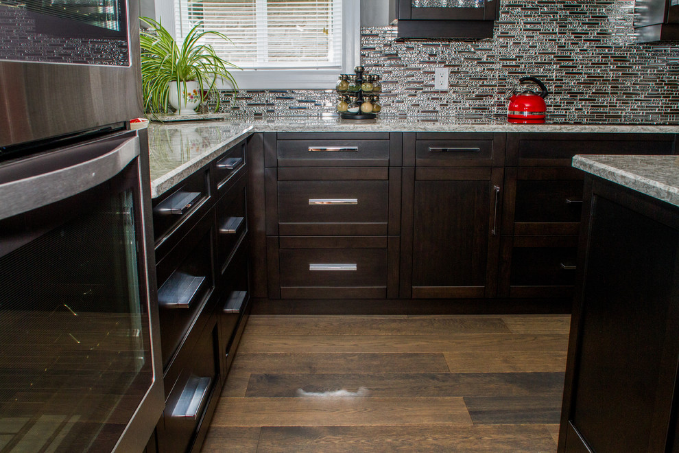Example of a transitional kitchen design in Toronto