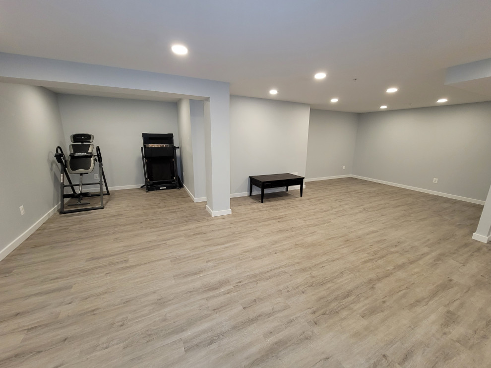Inspiration for a mid-sized contemporary vinyl floor and brown floor multiuse home gym remodel in DC Metro with gray walls