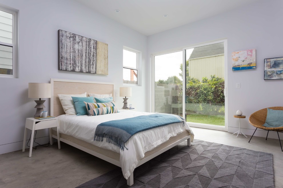 Design ideas for a large modern master bedroom in San Francisco with white walls, concrete floors and no fireplace.