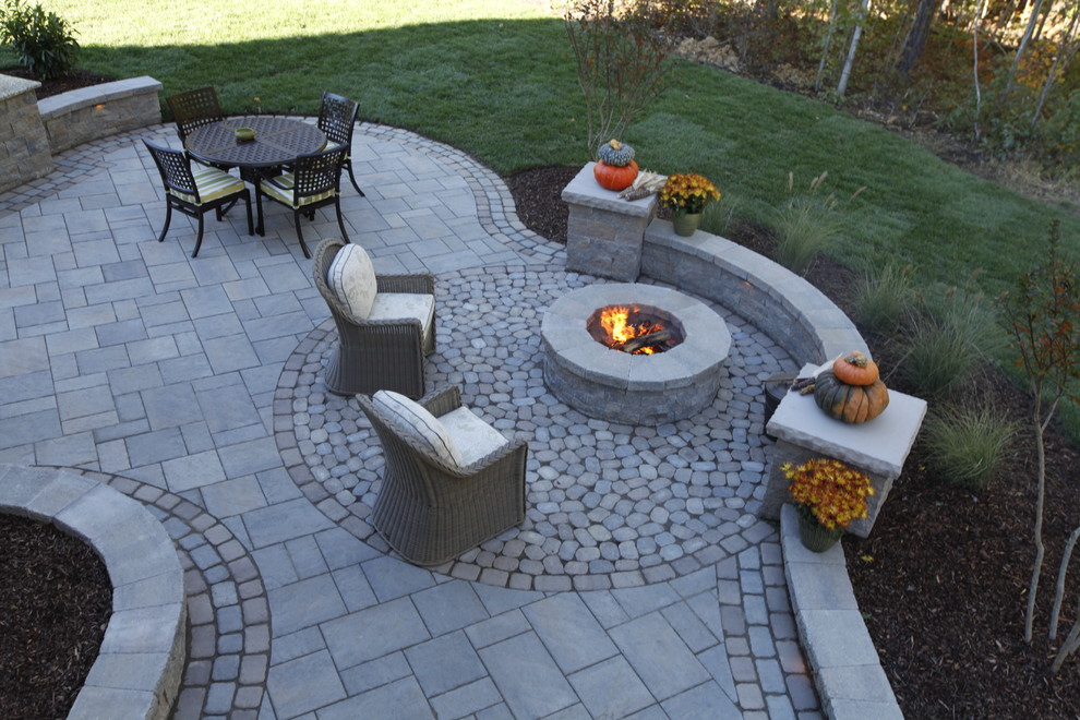 Mid-sized elegant backyard concrete paver patio photo in Richmond with a fire pit and no cover