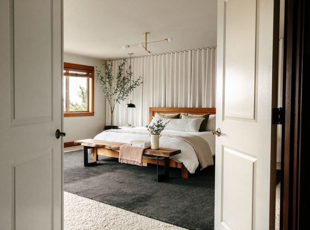 Large trendy master carpeted and beige floor bedroom photo in Seattle with gray walls, a two-sided fireplace and a tile fireplace