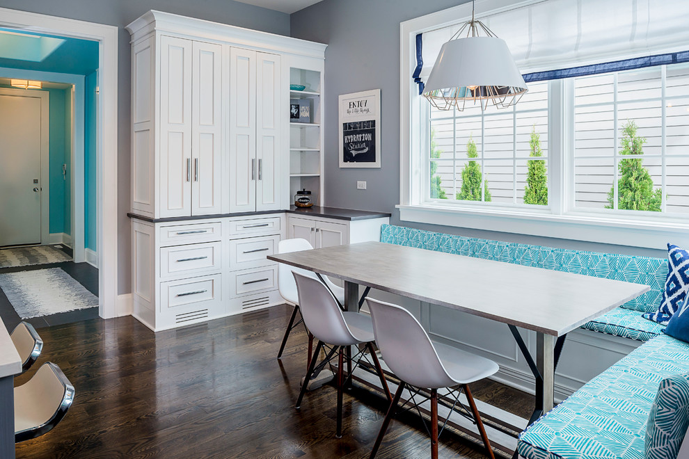 Eat-in kitchen - small transitional l-shaped eat-in kitchen idea in Chicago with recessed-panel cabinets, white cabinets and an island