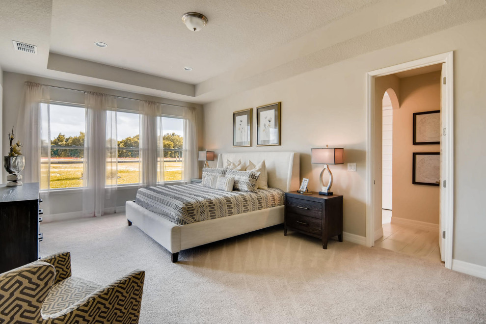 This is an example of a large traditional bedroom in Orlando.