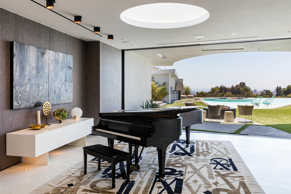 Photo of a contemporary open concept family room in Los Angeles with a music area, no fireplace, no tv and white floor.
