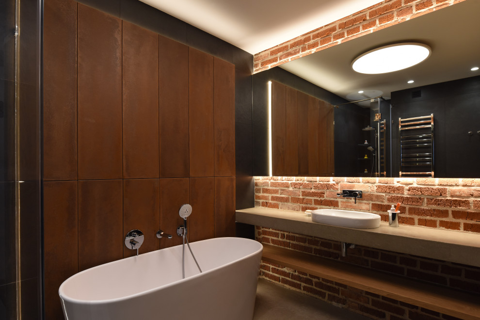 Photo of a mid-sized industrial master bathroom in Moscow with flat-panel cabinets, brown cabinets, a freestanding tub, red tile, terra-cotta tile, brown walls, concrete floors, concrete benchtops, grey floor, an open shower, grey benchtops, a corner shower and a vessel sink.