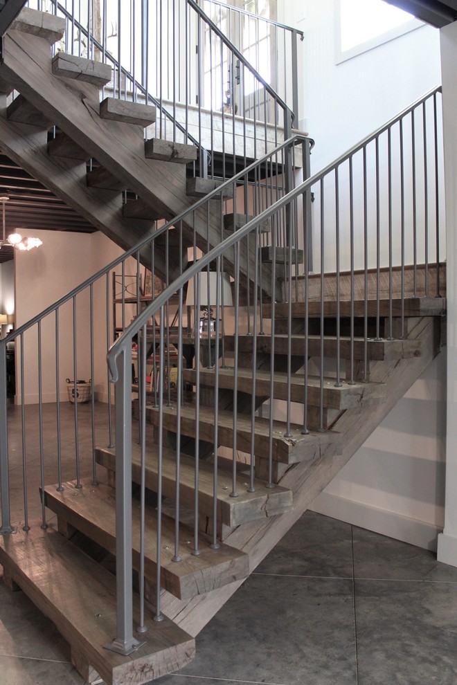 Staircase - mid-sized rustic wooden u-shaped open and metal railing staircase idea