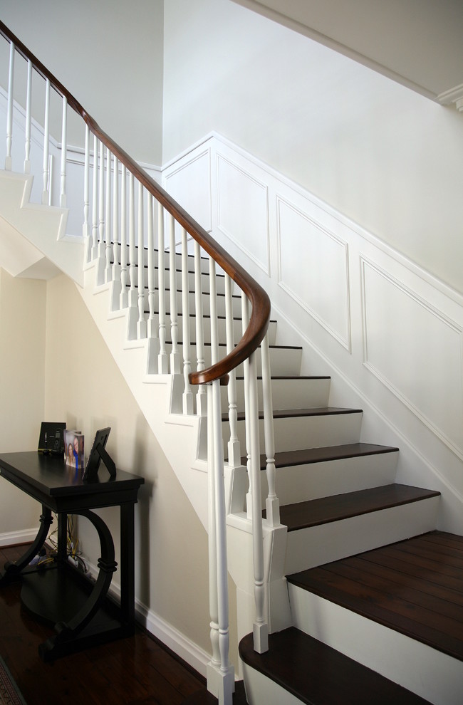 Photo of a mid-sized transitional wood l-shaped staircase in Sydney with painted wood risers.