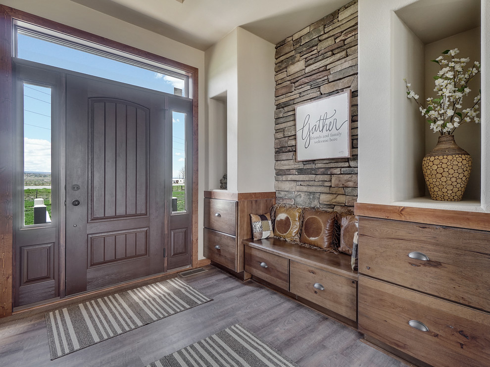 Example of a mid-sized mountain style linoleum floor and gray floor foyer design in Minneapolis with beige walls and a dark wood front door