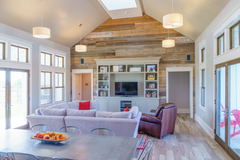 This is an example of a mid-sized country open concept living room in Austin with grey walls, ceramic floors, a built-in media wall and multi-coloured floor.