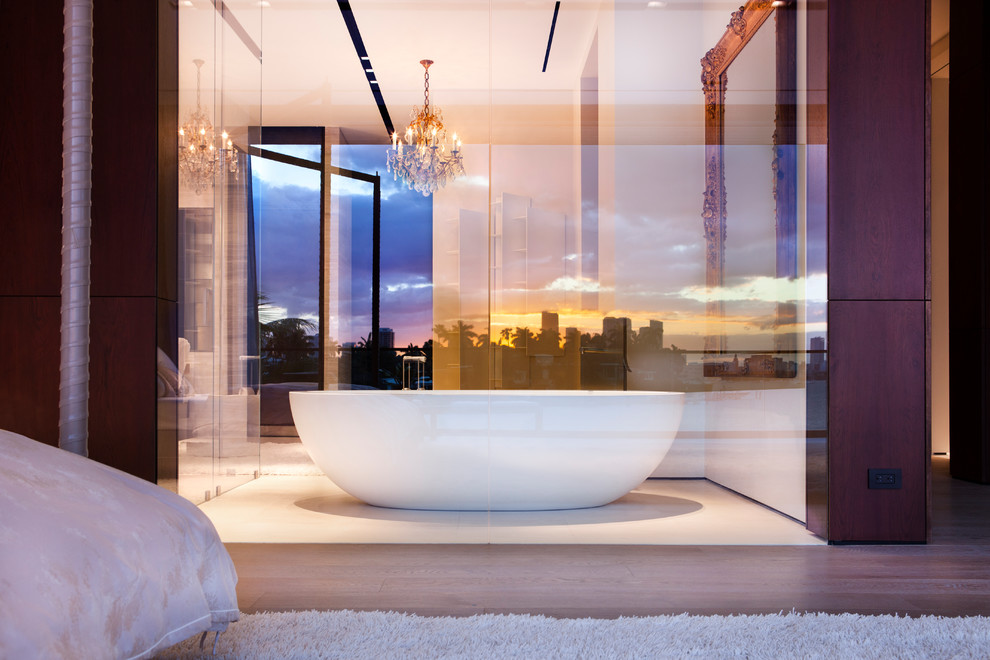 Large contemporary master bathroom in Miami with a freestanding tub, white walls and white floor.